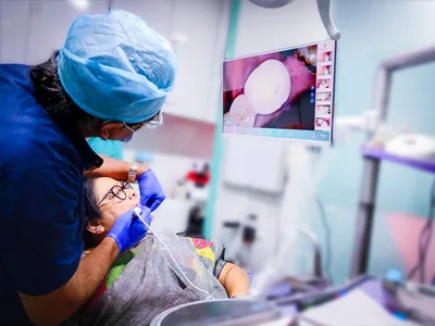 Oral and dental check up and on screen demonstration by intraoral camera at Dentity Dental Tollygunge Netaji Nagar